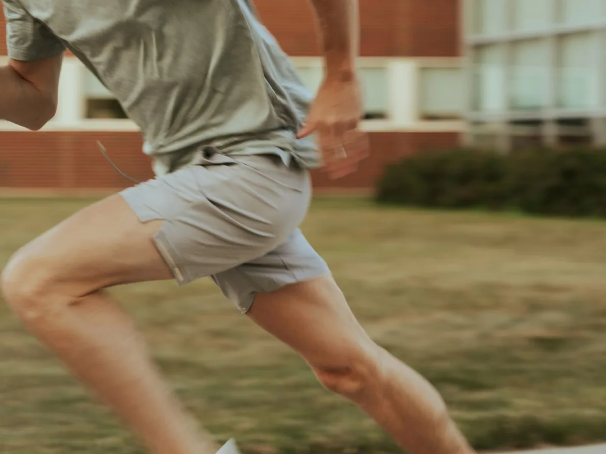 A runner on a road at dawn